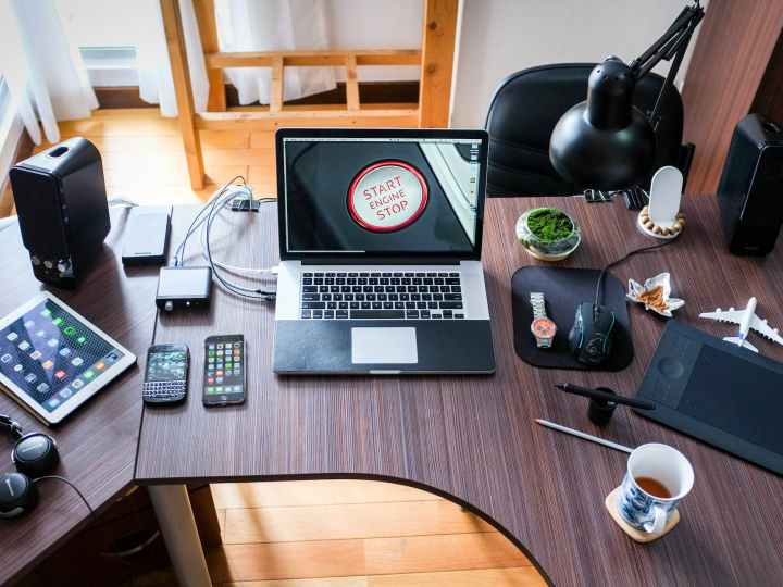 black and white laptop computer on brown wooden desk